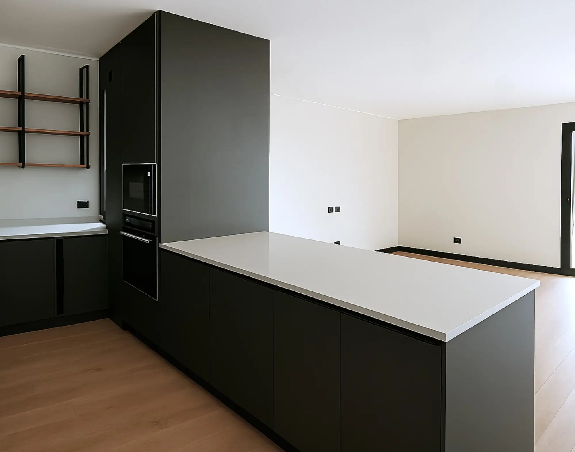 Cocina moderna con isla central en melamina negra mate, repisas flotantes de madera y electrodomésticos empotrados, diseño personalizado de Style Muebles en Chile